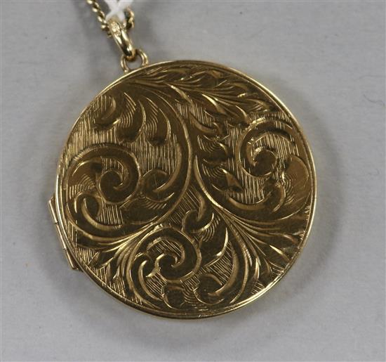 A 9ct gold circular enclosed locket on 9ct chain